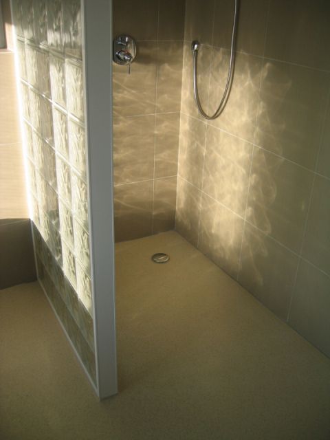 Coloured Bespoke Wet Room Floor with Coved Platform for Glass Brick Wall